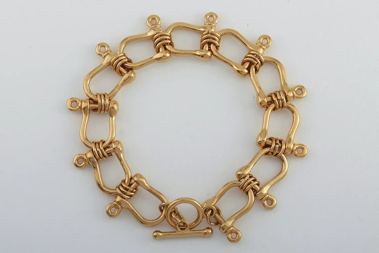 Before and after comparison of jewellery background removal — original image